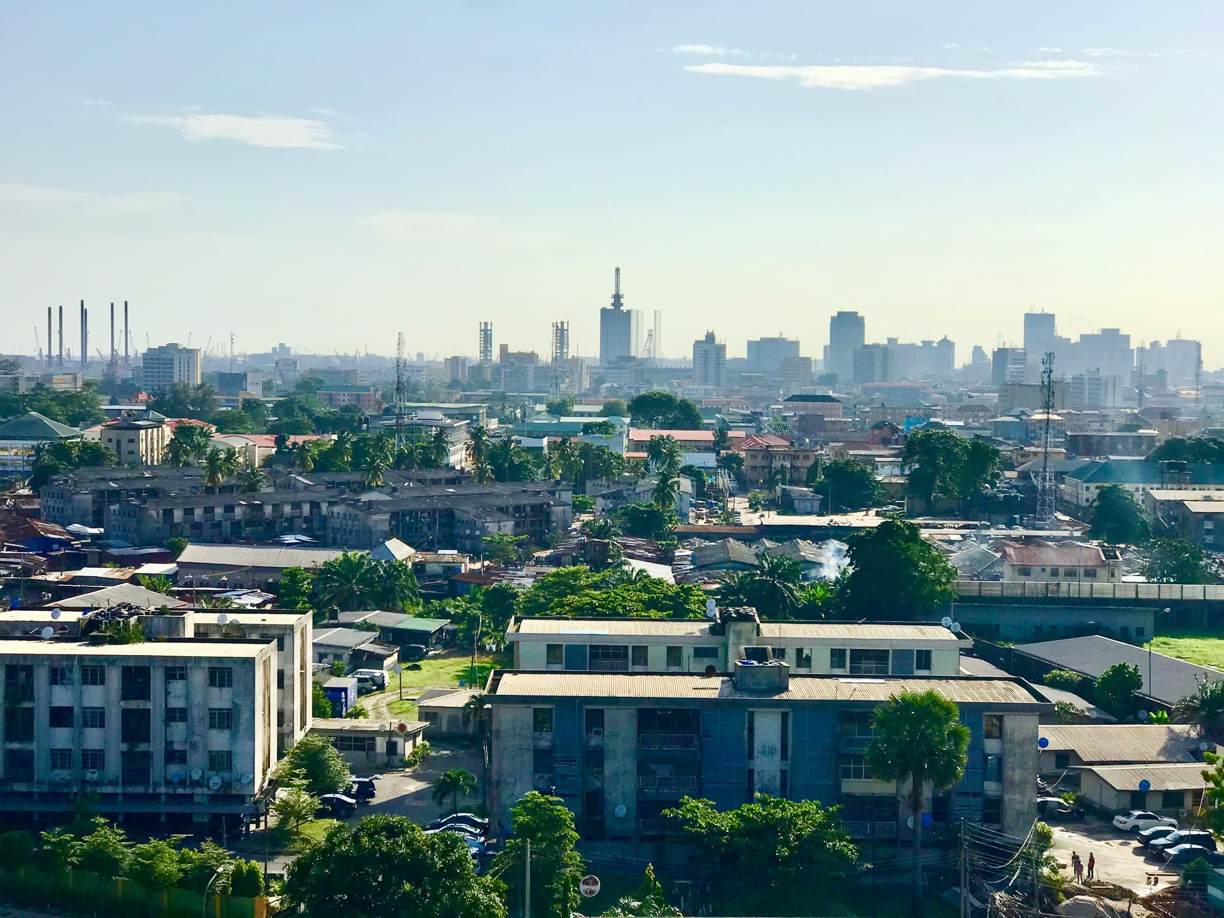 Homes and apartment blocks across a Lagos neighbourhood on a sunny day
